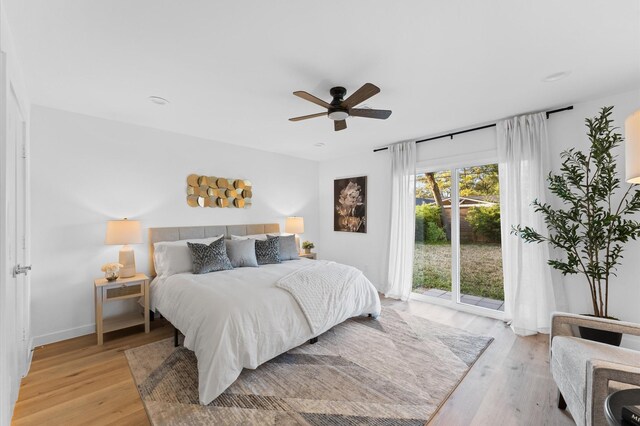 bedroom with a ceiling fan, access to outside, baseboards, and light wood finished floors