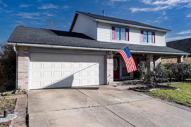 traditional-style house with a garage, brick siding, driveway, and a shingled roof