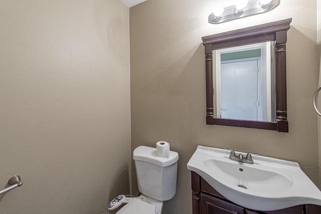 half bath with toilet and vanity