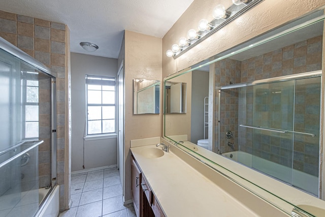 full bath with enclosed tub / shower combo, toilet, vanity, and tile patterned flooring