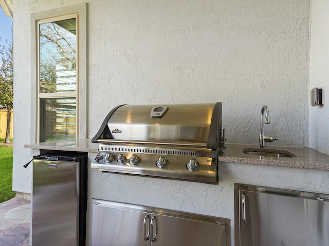 view of patio / terrace featuring a sink and area for grilling