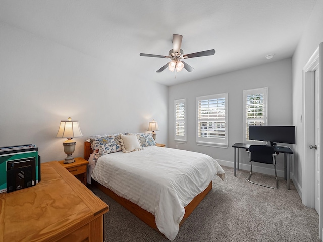 carpeted bedroom featuring a ceiling fan and baseboards