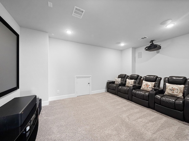 carpeted cinema room with recessed lighting, baseboards, and visible vents