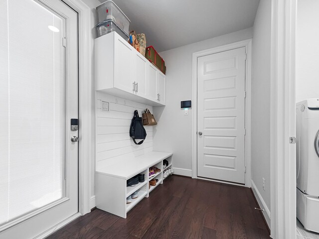 mudroom featuring washer / clothes dryer, baseboards, and dark wood-style flooring