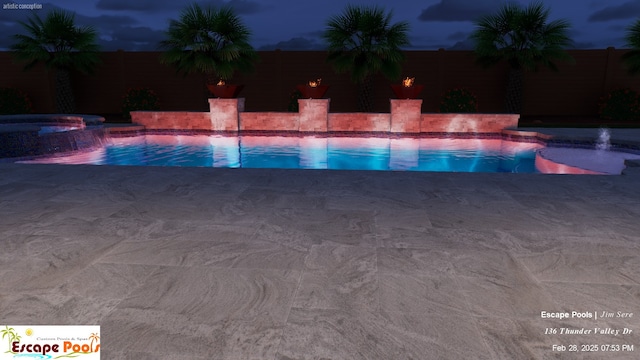 pool at night with a patio, a fenced backyard, and a pool with connected hot tub