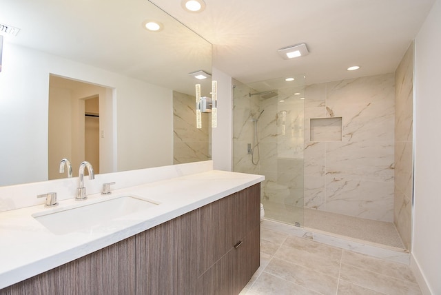 bathroom with visible vents, a marble finish shower, vanity, and recessed lighting