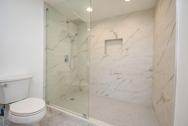 full bath featuring a marble finish shower and toilet