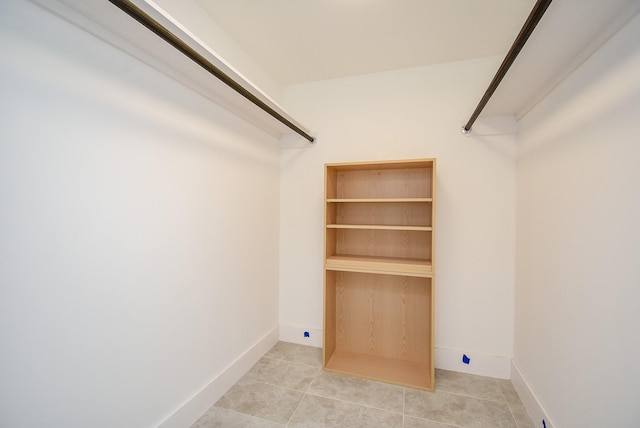 spacious closet featuring light tile patterned flooring