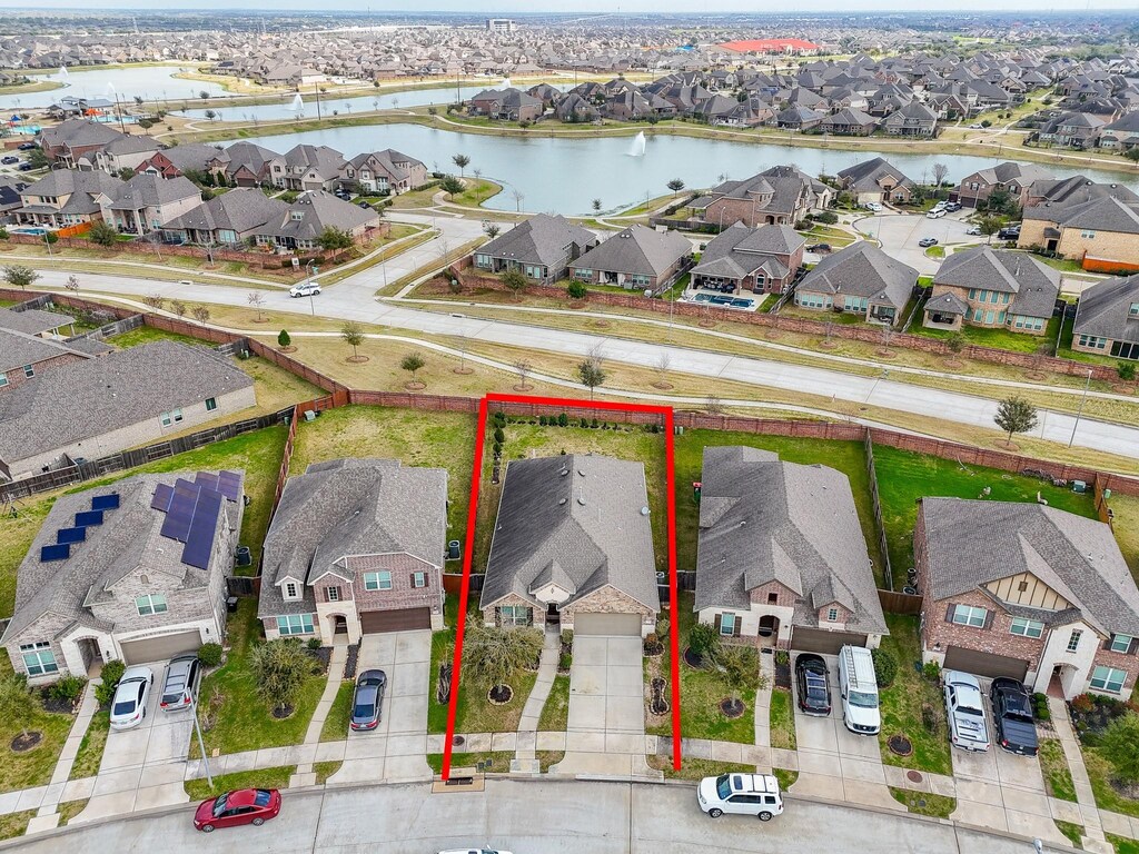 bird's eye view with a water view and a residential view