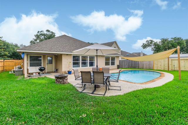 view of swimming pool featuring a patio, an outdoor fire pit, and a fenced backyard