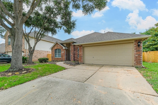 single story home featuring concrete driveway, brick siding, fence, and an attached garage