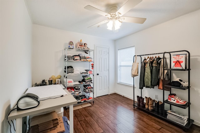 office space with ceiling fan, dark wood-style flooring, and baseboards