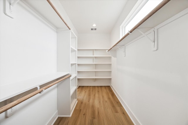 spacious closet featuring visible vents and light wood finished floors