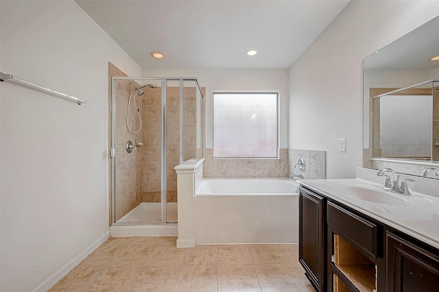 full bathroom with a garden tub, a stall shower, tile patterned flooring, and vanity