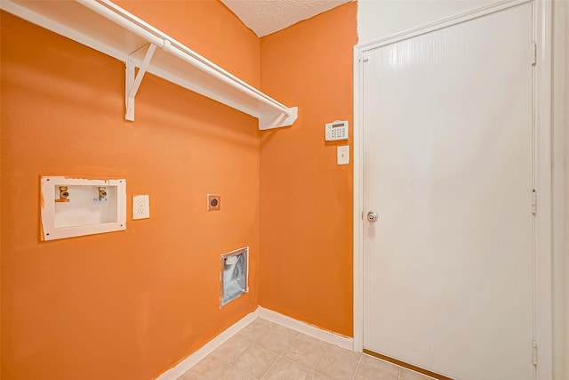 laundry room with laundry area, baseboards, tile patterned floors, hookup for a washing machine, and hookup for an electric dryer