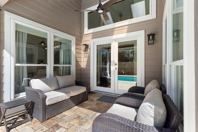 view of patio / terrace with a ceiling fan, french doors, and an outdoor living space