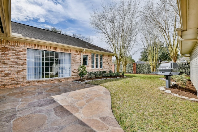 view of yard featuring a patio and fence