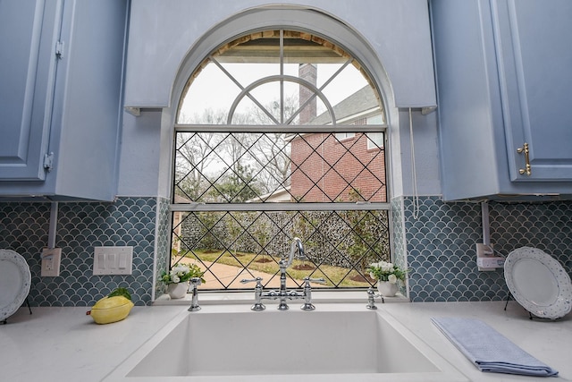 bathroom with backsplash and a freestanding bath