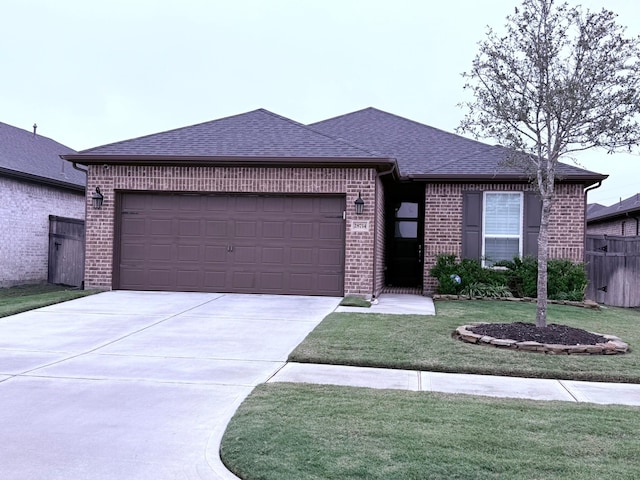 view of front of property with brick siding, a shingled roof, fence, a garage, and driveway