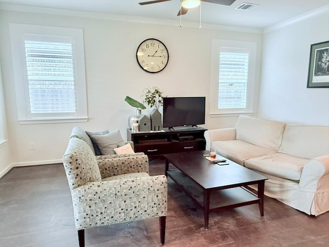 living area with plenty of natural light, visible vents, crown molding, and baseboards