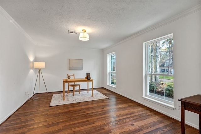 unfurnished office with visible vents, ornamental molding, and a wealth of natural light