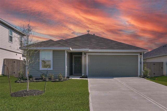 view of front facade featuring a garage, fence, driveway, a gate, and a front yard