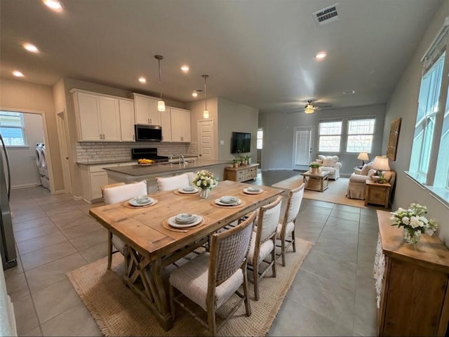 dining area featuring plenty of natural light, visible vents, and recessed lighting