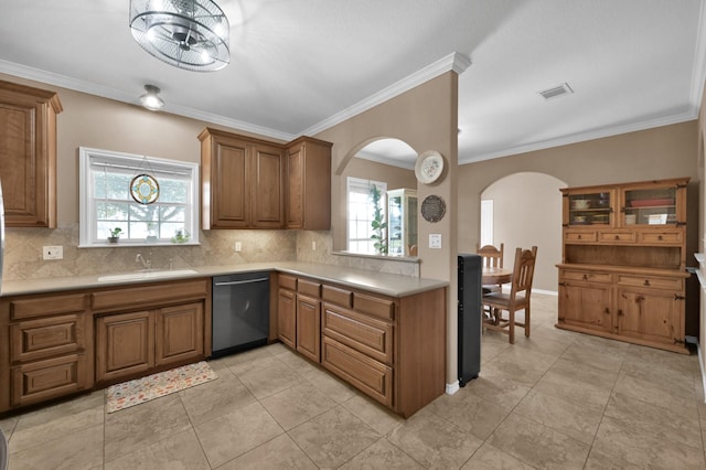 kitchen with a sink, visible vents, stainless steel dishwasher, and light countertops