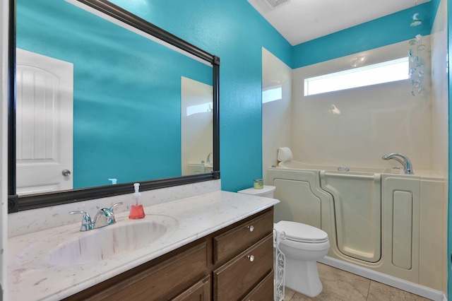 full bathroom with visible vents, toilet, tile patterned flooring, a bath, and vanity