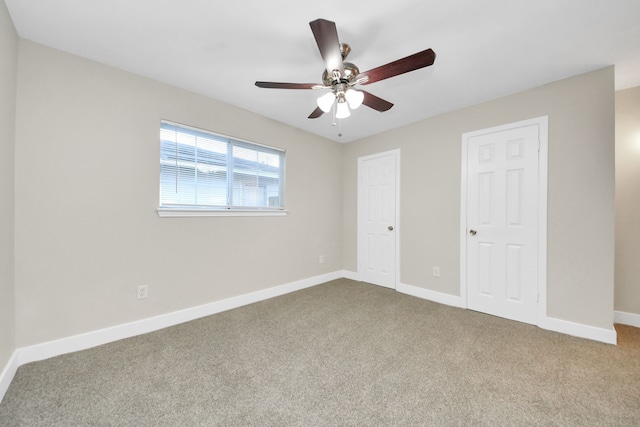 unfurnished bedroom featuring carpet flooring, ceiling fan, and baseboards