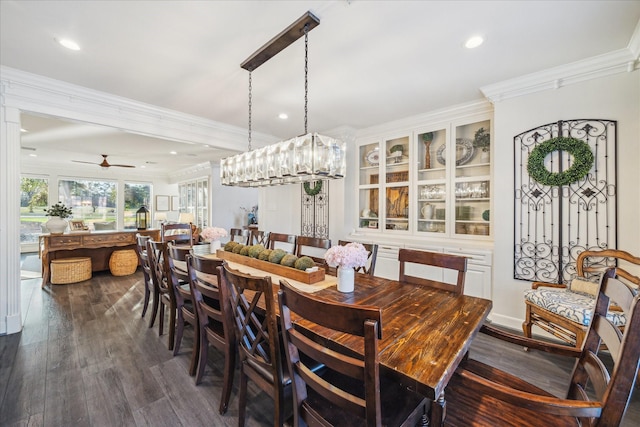 dining area featuring a ceiling fan, ornamental molding, dark wood-type flooring, and recessed lighting