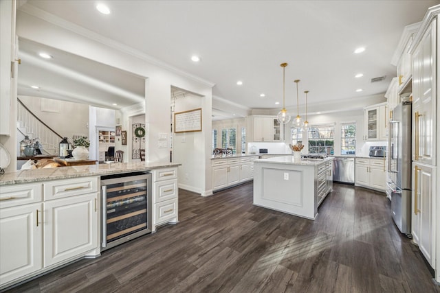 kitchen with visible vents, wine cooler, glass insert cabinets, stainless steel appliances, and white cabinetry