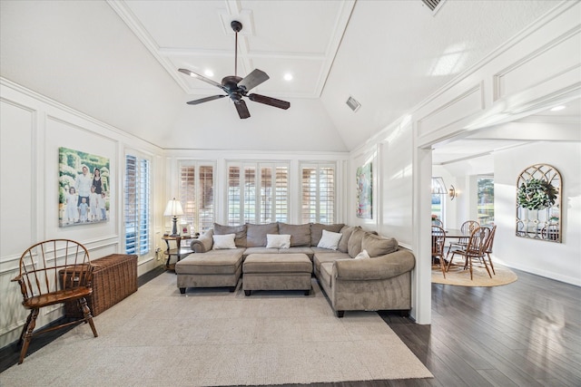 living area with ornamental molding, high vaulted ceiling, dark wood-type flooring, and a ceiling fan