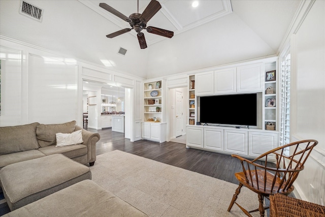 living room with dark wood-type flooring, visible vents, ceiling fan, and high vaulted ceiling