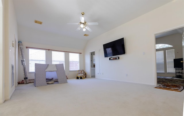 rec room featuring a ceiling fan, visible vents, vaulted ceiling, and carpet flooring