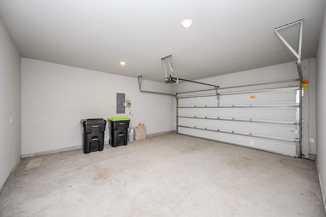 garage with electric panel and a garage door opener