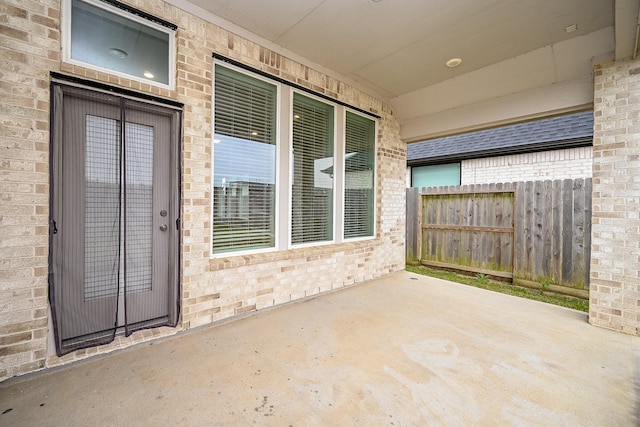 view of patio / terrace featuring fence