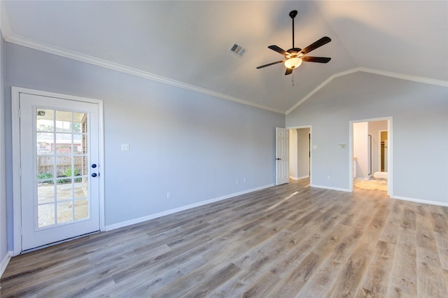 unfurnished room featuring baseboards, visible vents, ceiling fan, vaulted ceiling, and light wood-type flooring