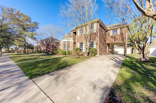 view of front of home featuring concrete driveway, stone siding, an attached garage, a front lawn, and brick siding