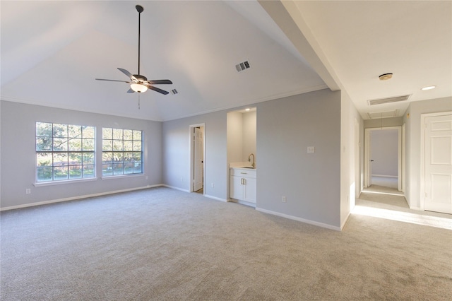 interior space with visible vents, light carpet, attic access, and baseboards