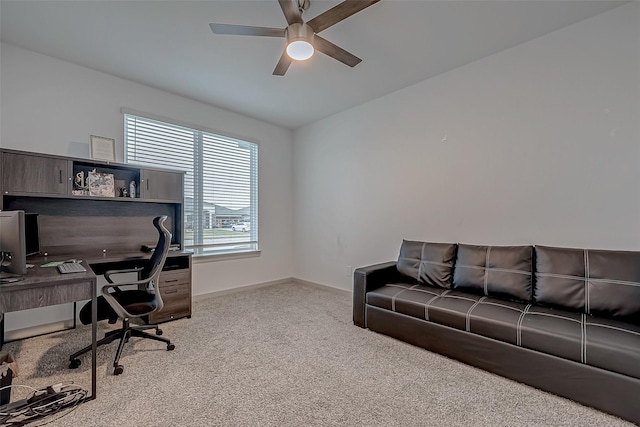 home office with baseboards, a ceiling fan, and carpet flooring