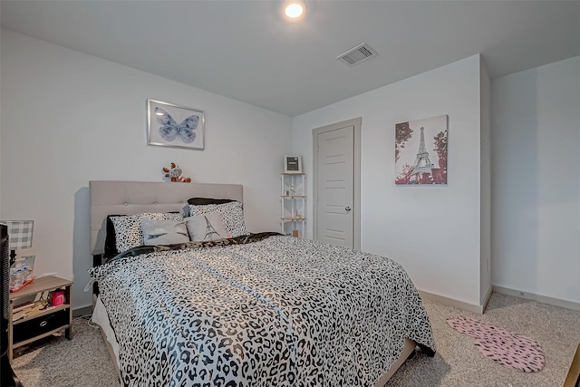 bedroom featuring carpet floors, visible vents, and baseboards