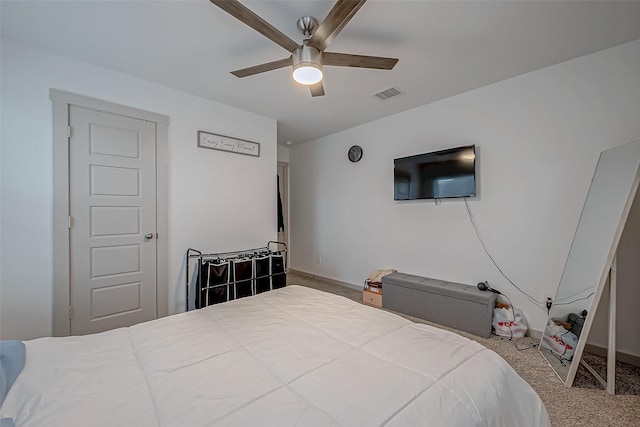 carpeted bedroom with a ceiling fan, visible vents, and baseboards