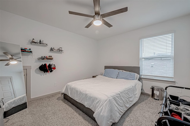 bedroom with carpet floors, baseboards, and a ceiling fan