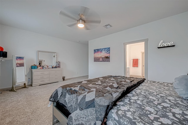 carpeted bedroom featuring ceiling fan, connected bathroom, and visible vents