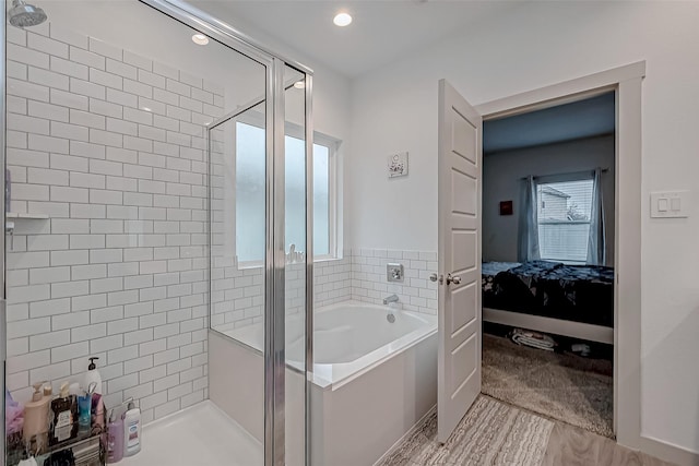 bathroom featuring a garden tub, a shower stall, connected bathroom, and recessed lighting