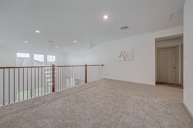 empty room featuring carpet, visible vents, baseboards, and recessed lighting