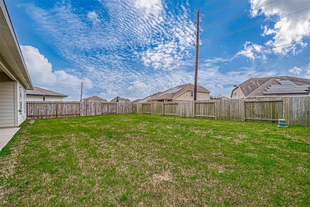 view of yard with a fenced backyard