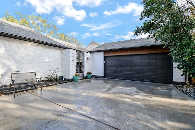 exterior space featuring concrete driveway