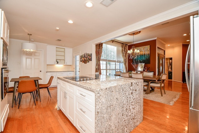 kitchen with open shelves, freestanding refrigerator, oven, a notable chandelier, and black electric cooktop